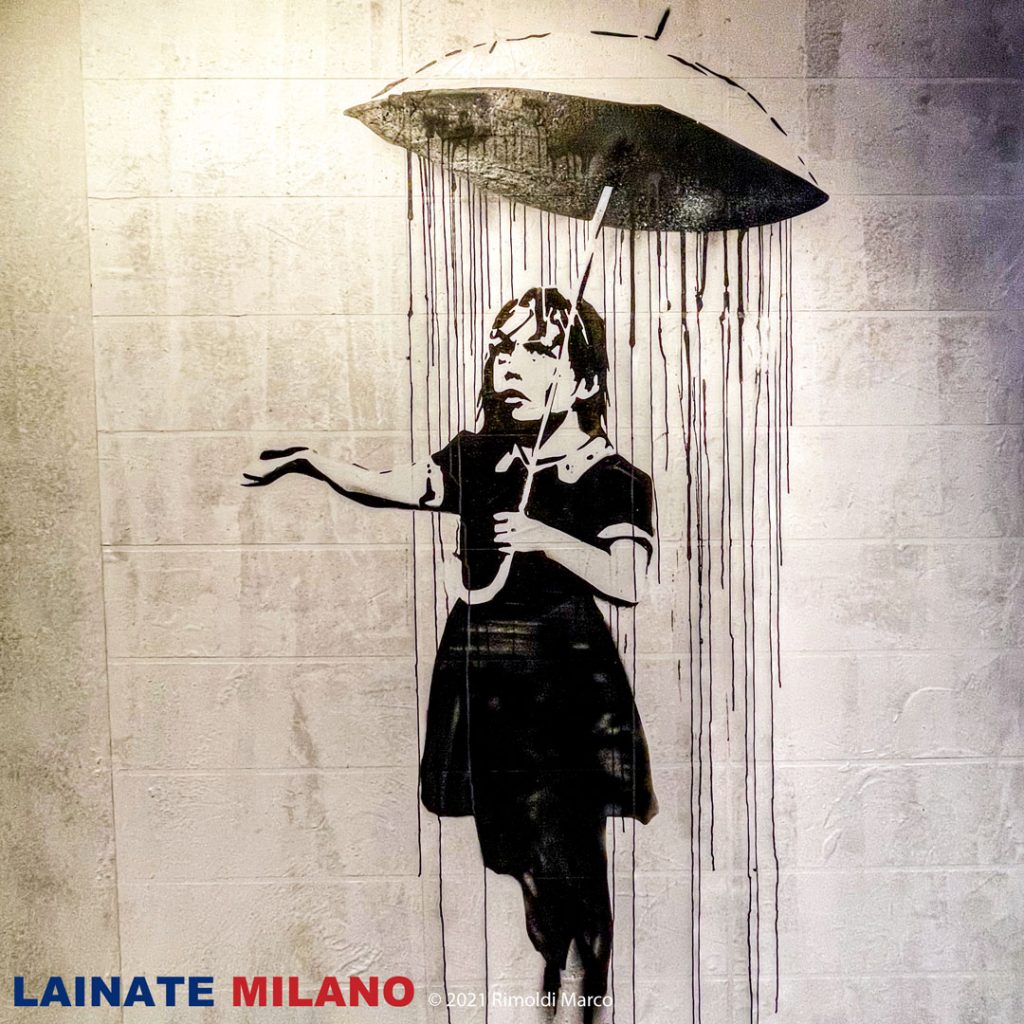 THE WORLD OF BANKSY -  The Umbrella Girl